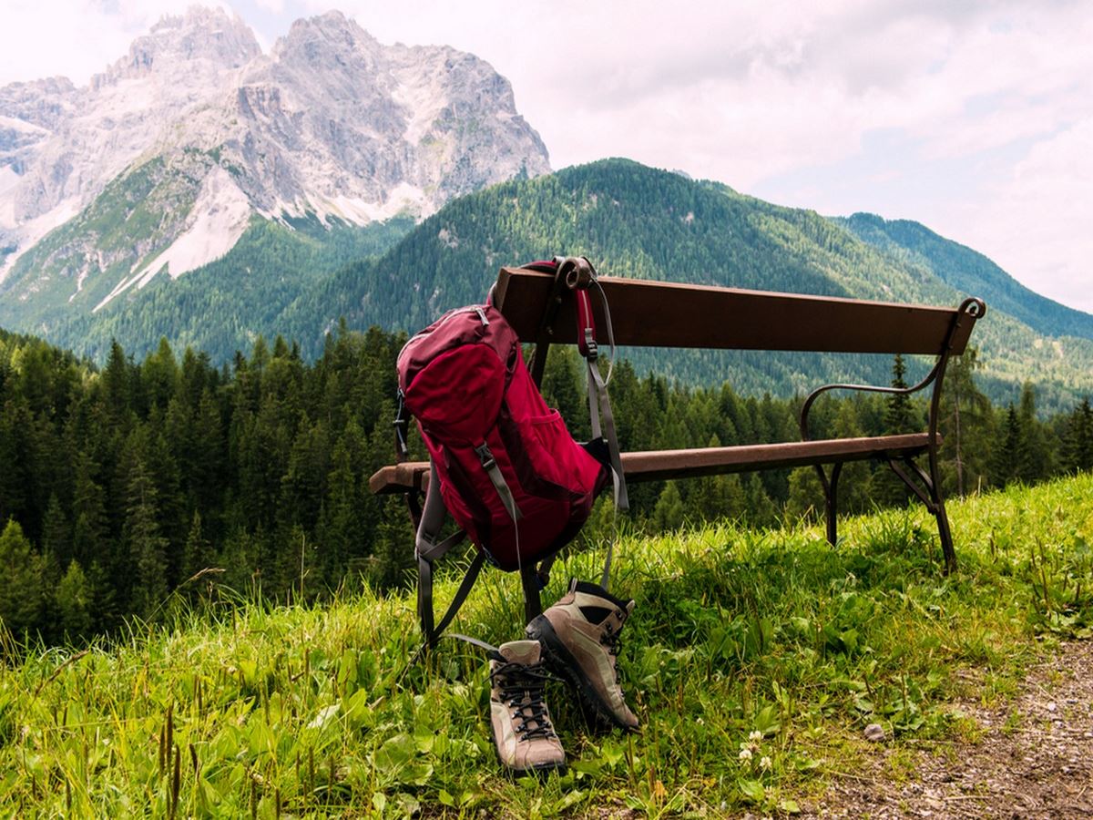 Hiking backpack and boots in South Tyrol Austria, benefits of hiking