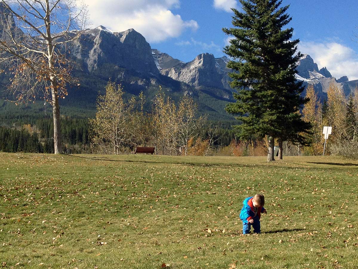 Playing in the park on the Main Street, Bow River and the Rail Bridge Hike in Canmore, Alberta