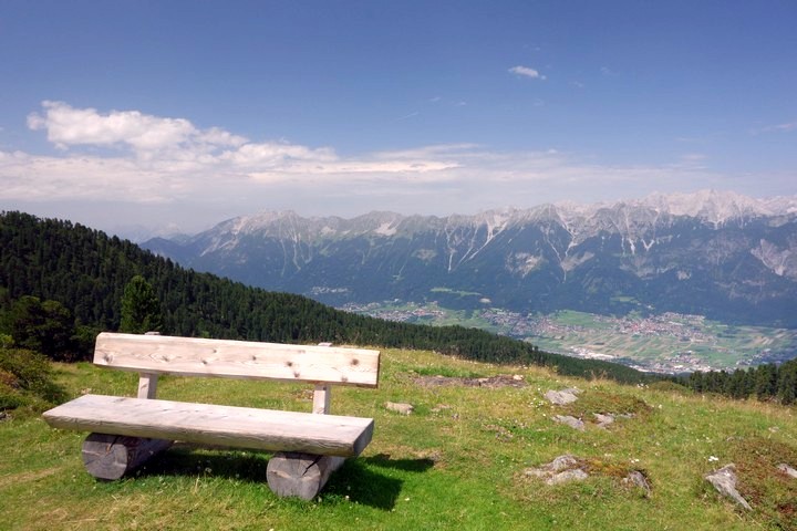 Bench on Zirbenweg trail to enjoy the view in Innsbruck