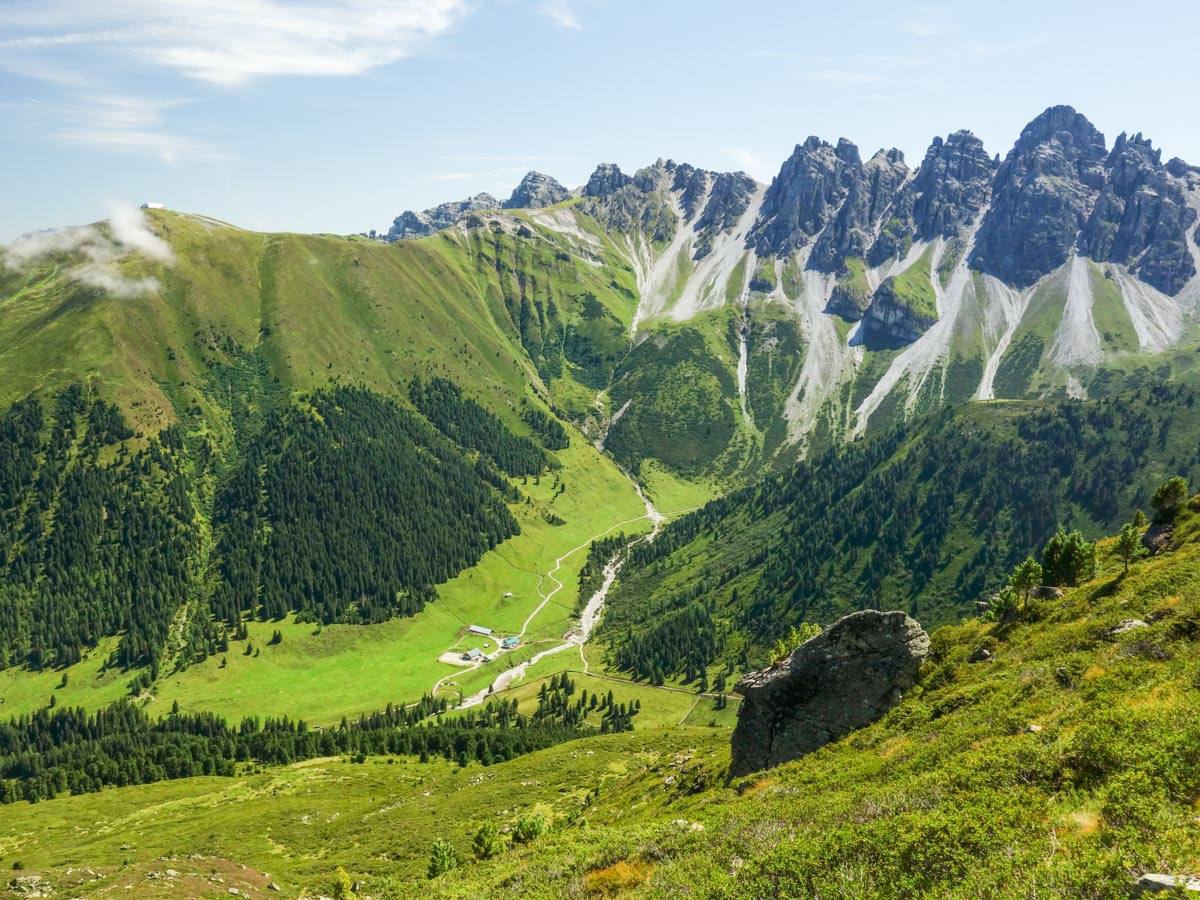 Kemater Alm in the basin surrounded by mountains on the Schaflegerkogel Loop Hike in Innsbruck, Austria