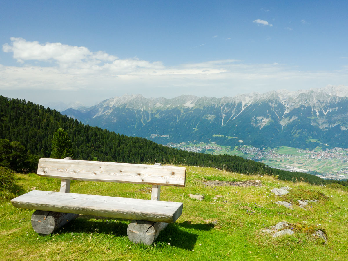 One of the many benches to rest and enjoy the view along the Zirbenweg Hike in Innsbruck, Austria