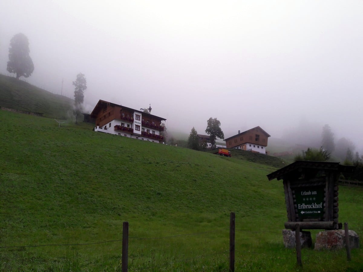 Traditional Austrian farm at the lake on the Zeller Lake Loop Hike in Zell am See - Kaprun, Austria