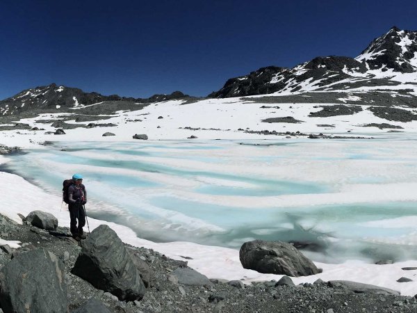 Icy Lake between Mont Fort and Cabane Prafleuri on the Walker's Haute Route from Chamonix to Zermatt