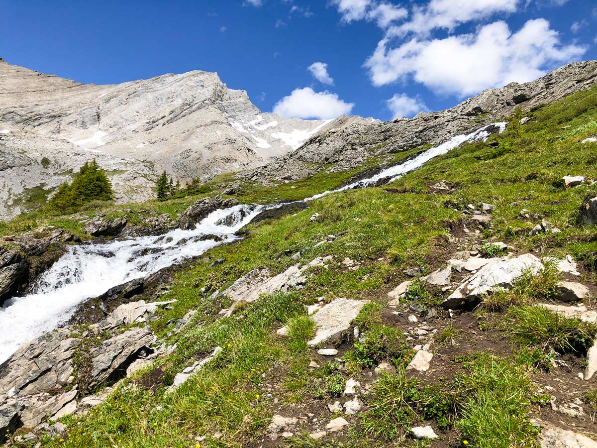 Trail beside the waterfall on the Headwall Lakes Hike near Smith-Dorrien Trail in Kananaskis, near Canmore