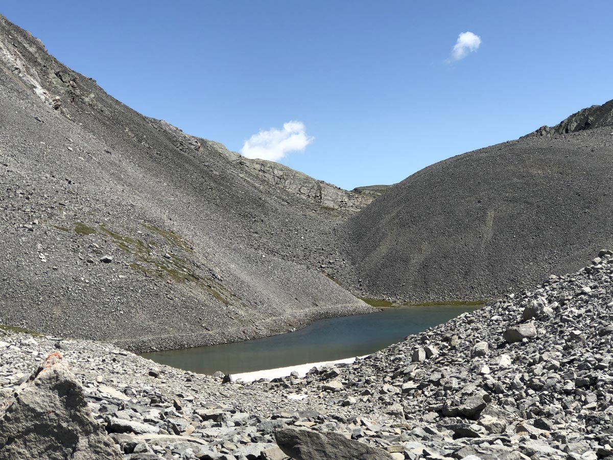 Path and the tarn on the Rummel Pass Hike near Smith-Dorrien Trail in Kananaskis, near Canmore