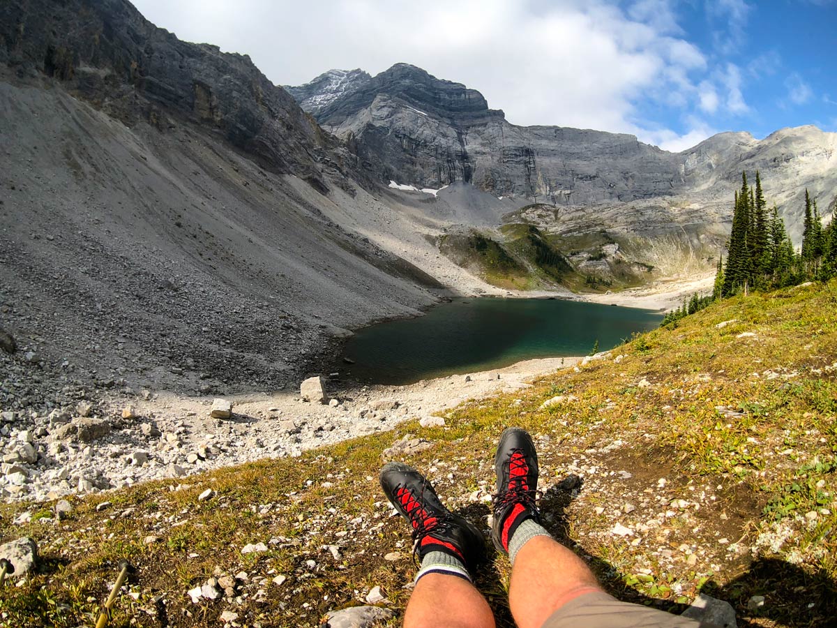 Hiker resting his feet on Lillian and Galatea Lakes Hike in Kananaskis, near Canmore