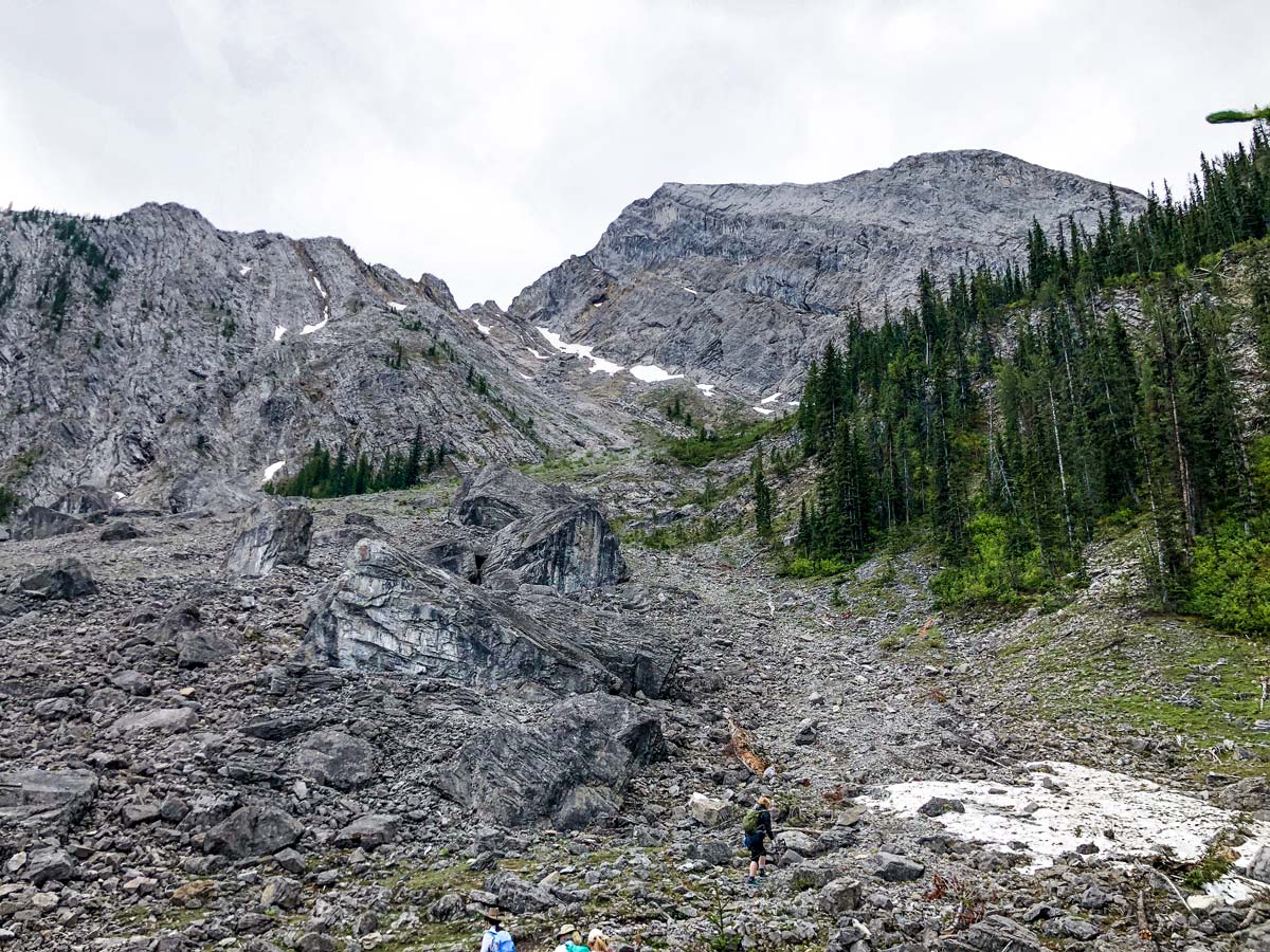 At the base of the steep scree slope on the Old Goat Glacier Hike near Smith-Dorrien Trail in Kananaskis, near Canmore