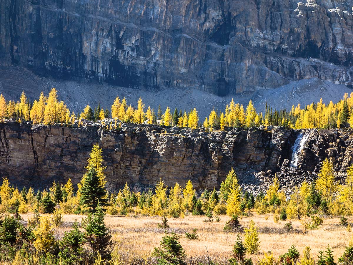 A view back of the Chimney to the left of the waterfall on the Skoki Lakes Hike from Lake Louise in Banff National Park