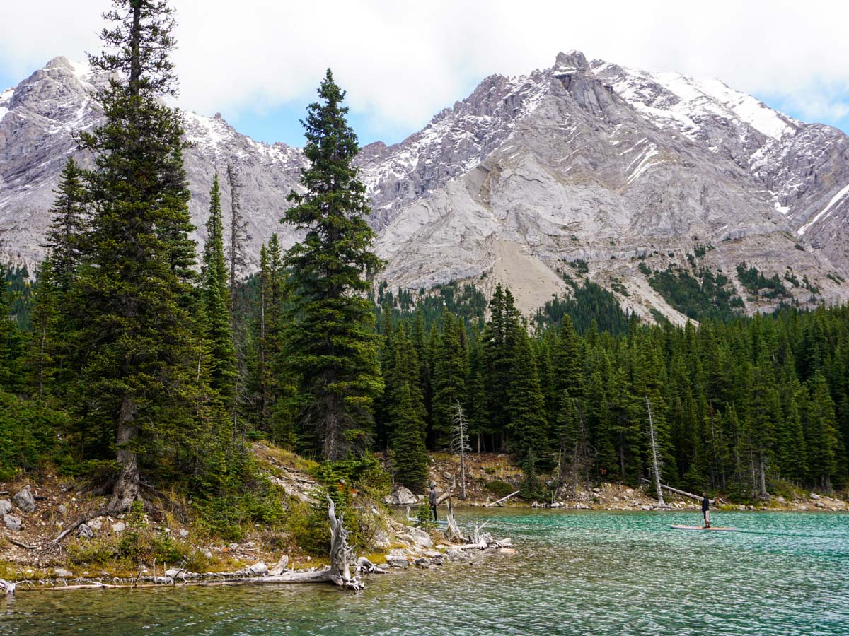 Paddleboarding on the lake on the Elbow Lake Hike in Kananaskis, near Canmore