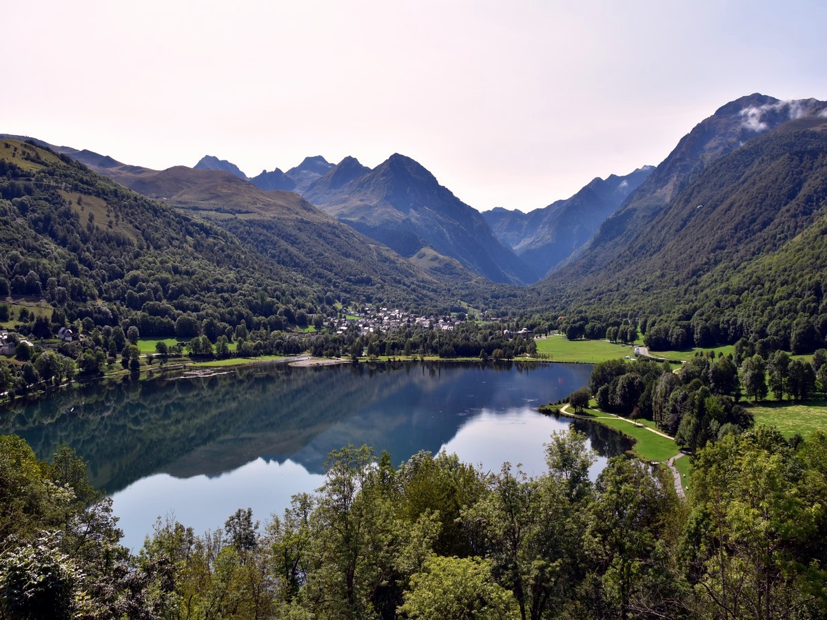 Lovely views over the lake and village from the castle on the Lac de Loudenvielle Hike in French Pyrenees