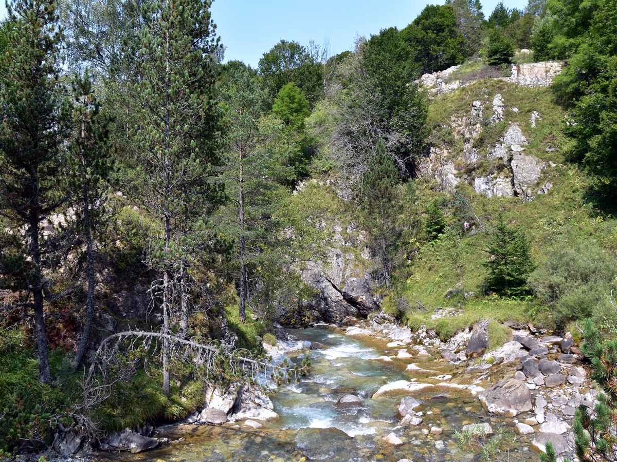 Crossing the bridge on the Cirque de Gavarnie Hike in French Pyrenees