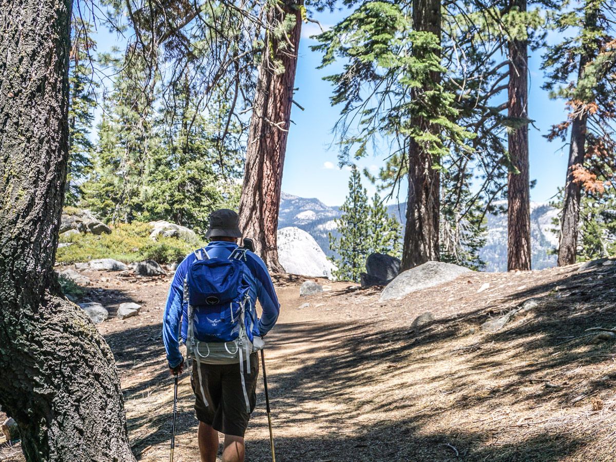 Hiker on Sentinel Dome to Glacier Point trail in Yosemite National Park