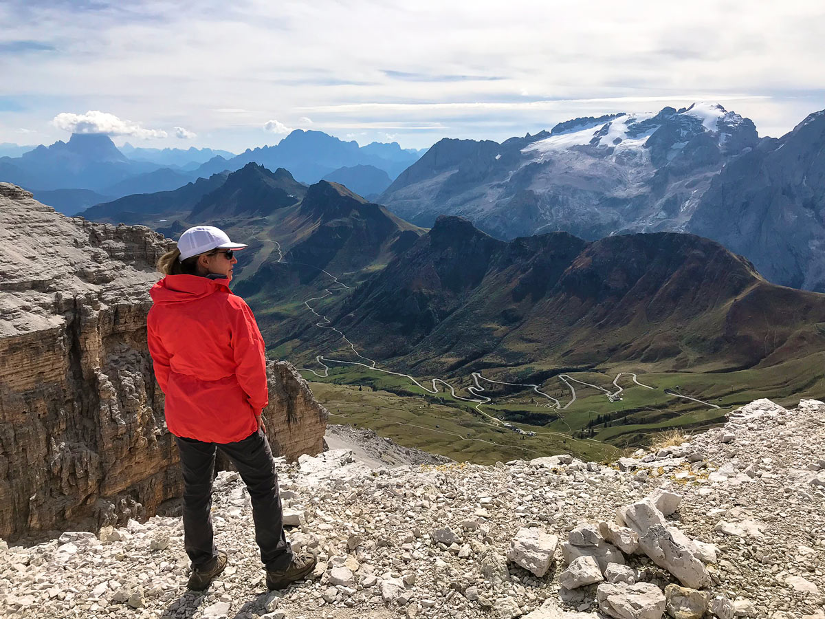 Woman wearing red Zeta AR jacket on a hike