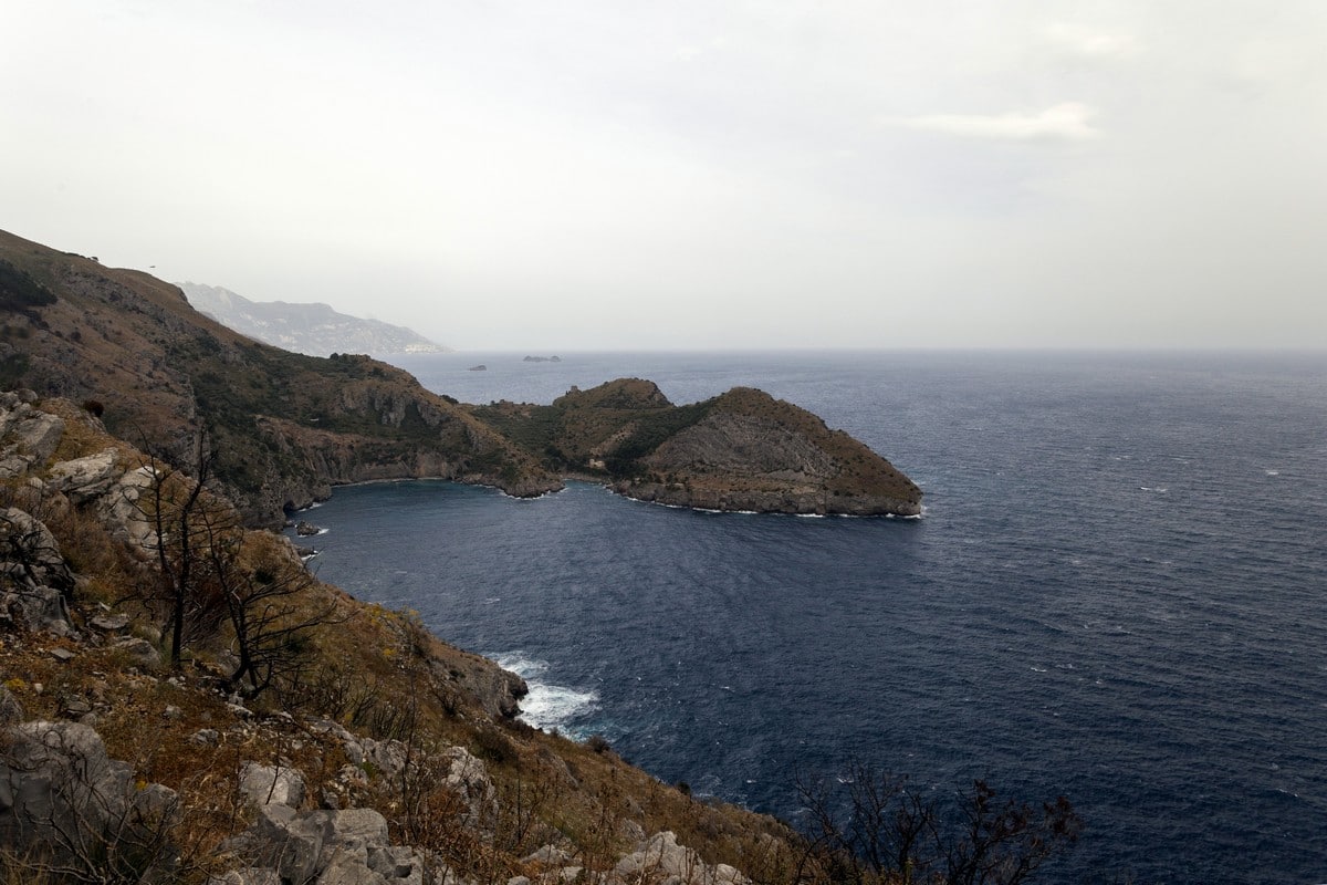 Bay of Ieranto and the Amalfi coast behind from the Punta Campanella Hike in Amalfi Coast, Italy