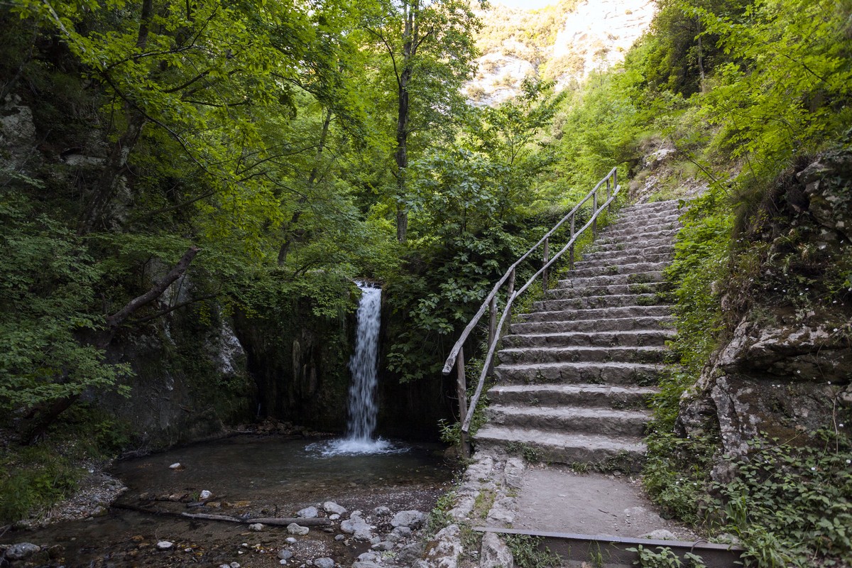 Stairs and one of the major falls of the Valle dei Mulini Hike in Amalfi Coast, Italy