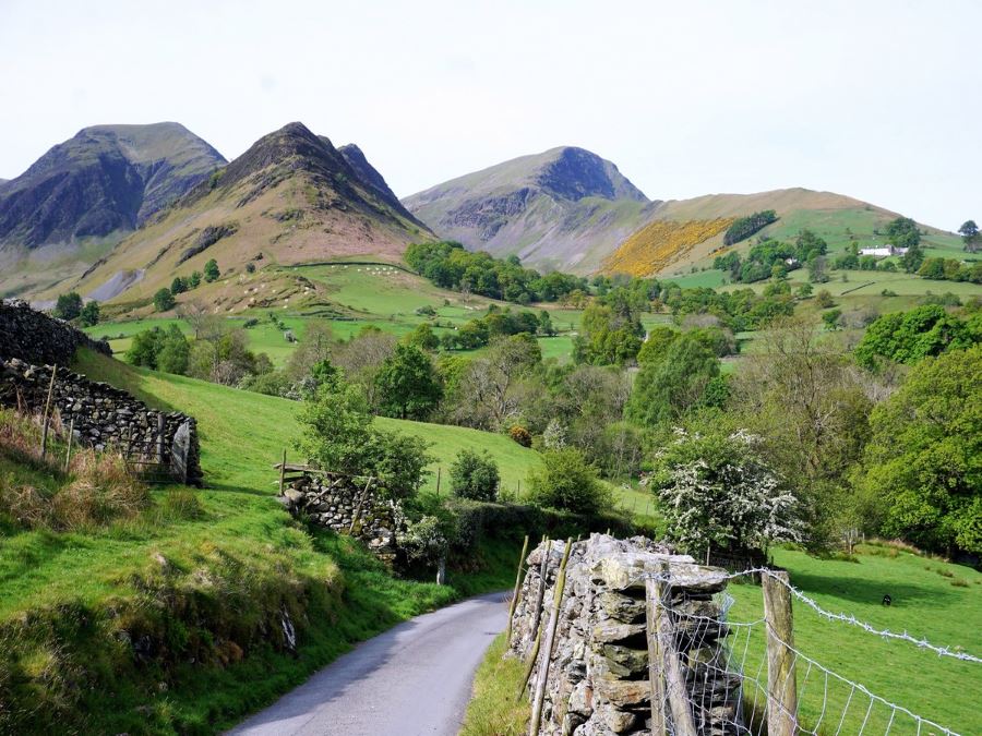 Walking out of Tiny Town towards Robinson on the Newlands Horseshoe Hike in Lake District, England