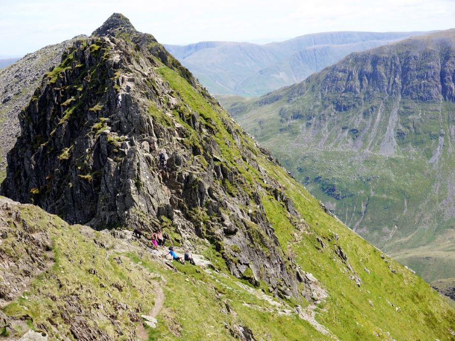 Climbing down from Striding Edge on the Helvellyn via Striding and Swirral Edge Hike in Lake District, England
