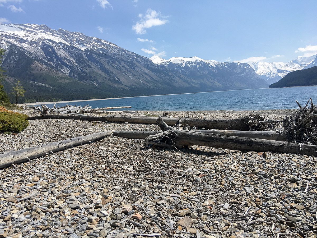 Walking along the lake on the Aylmer Lookout via Lake Minnewanka Hike near Banff