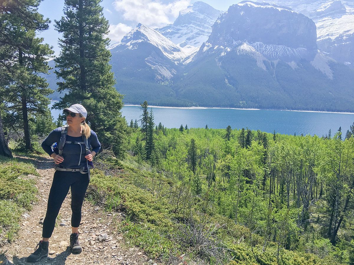 Lady on a trail of the Aylmer Lookout via Lake Minnewanka Hike near Banff