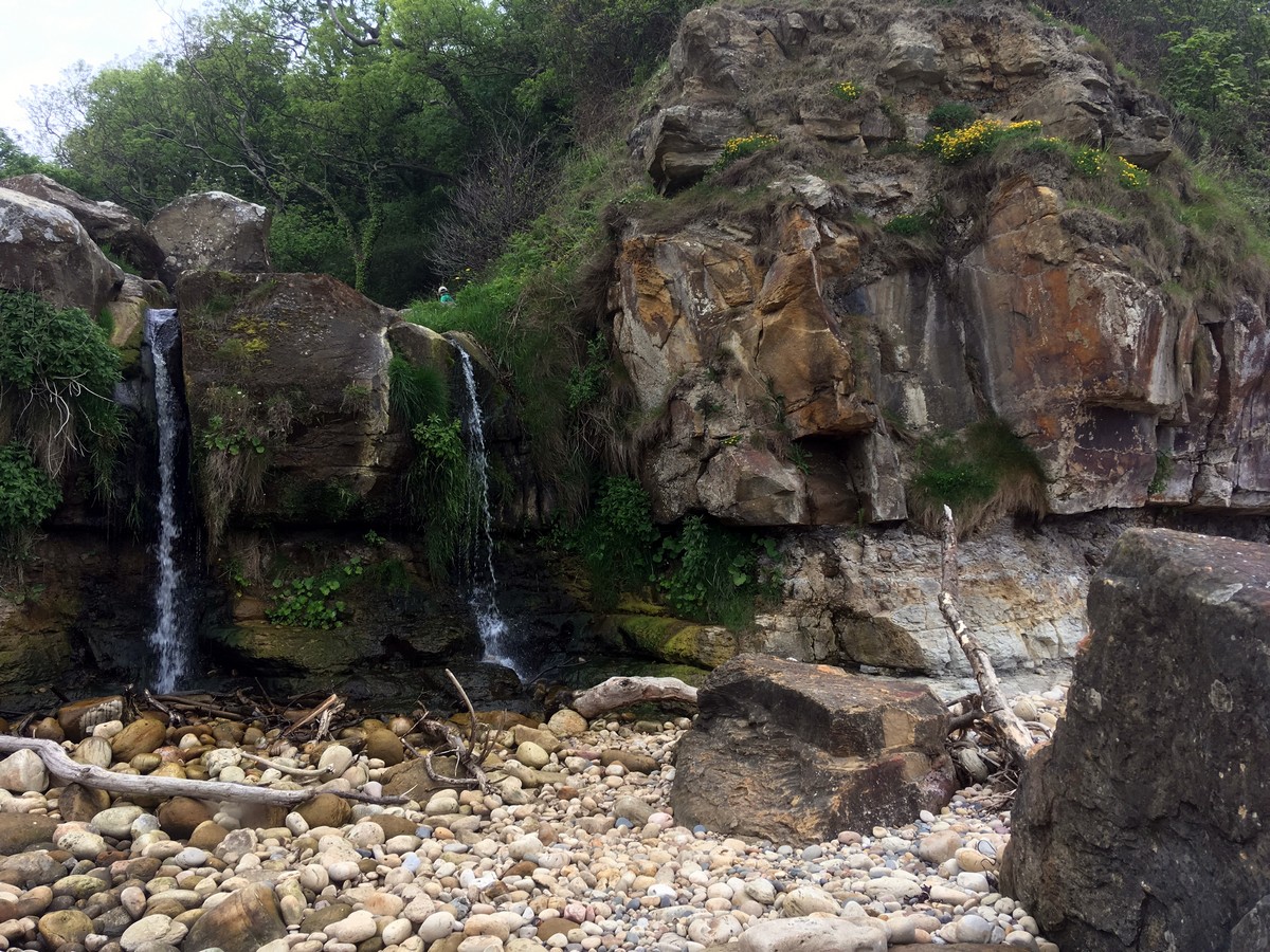 Waterfall at Hayburn Wyke on the Cloughton and Hayburn Wyke Hike in North York Moors, England