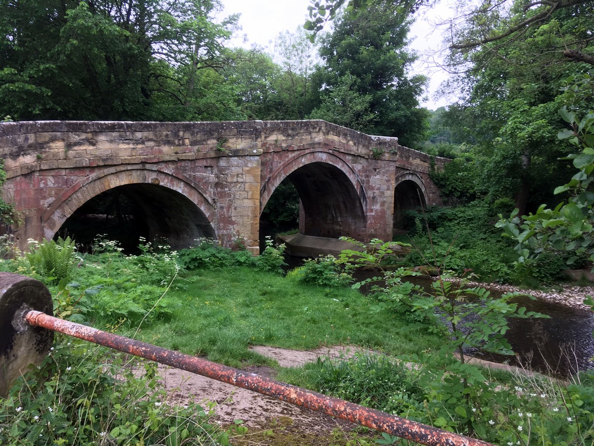 Bridge crossing River Rye on the Helmsley to Rievaulx Abbey Hike in North York Moors, England