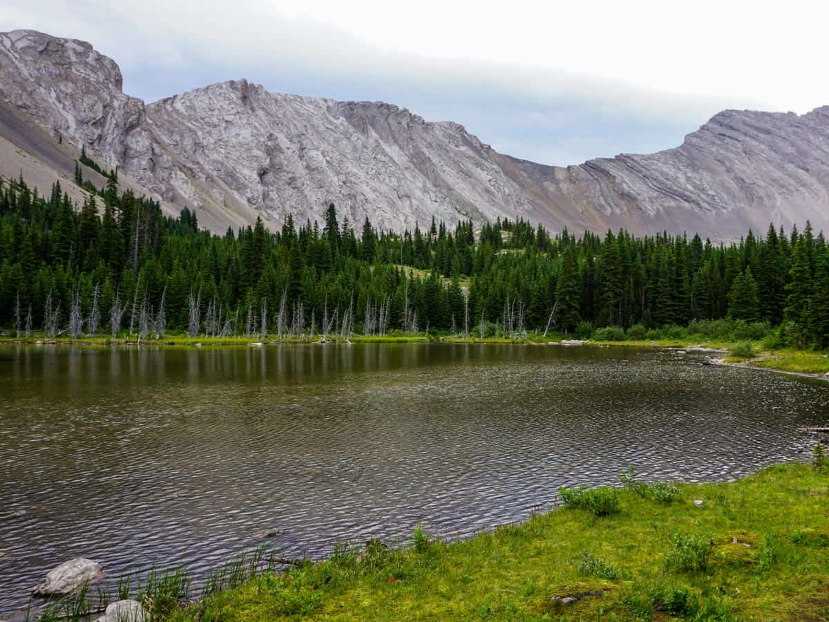 Walking around the lake on the Picklejar Lakes Hike in Kananaskis, near Canmore