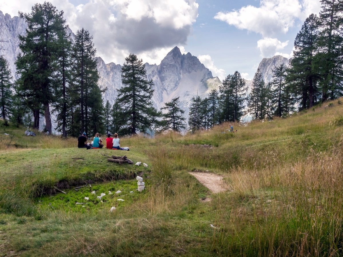 Group of hikers enjoying the views on Slemenova Spica hike in Julian Alps