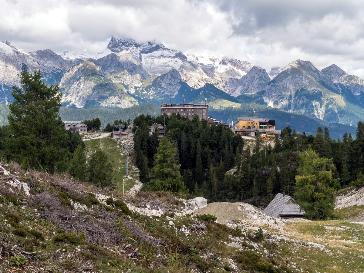 Vogel Ski Hotel with Mount Triglav on the horizon on the Vogel and Rodica Hike in Julian Alps, Slovenia