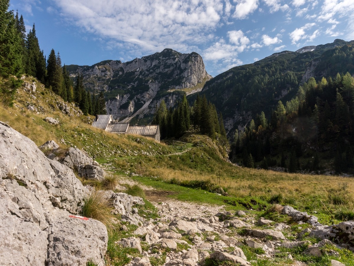 Duplje pasture with Mount Velika Baba behind on the battlefield of Mount Krn Hike in Julian Alps, Slovenia