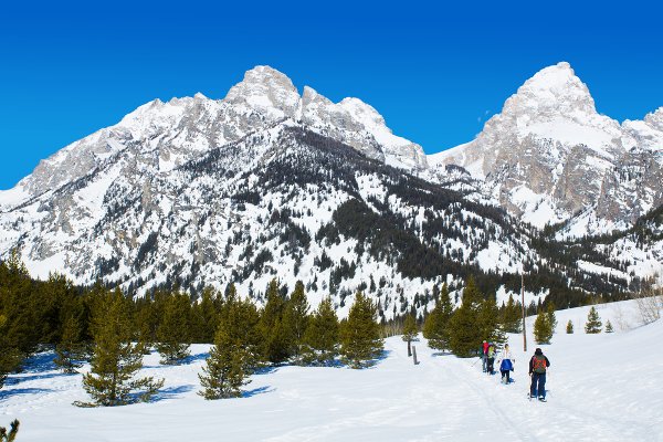 Snowshoeing on a winter weekend in Grand Teton National Park is a great idea for a family holiday