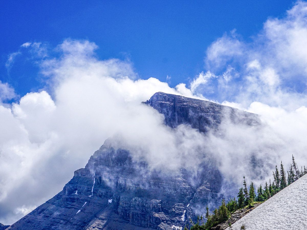 Mountain in the clouds at Swiftcurrent Pass Hike at Glacier National Park