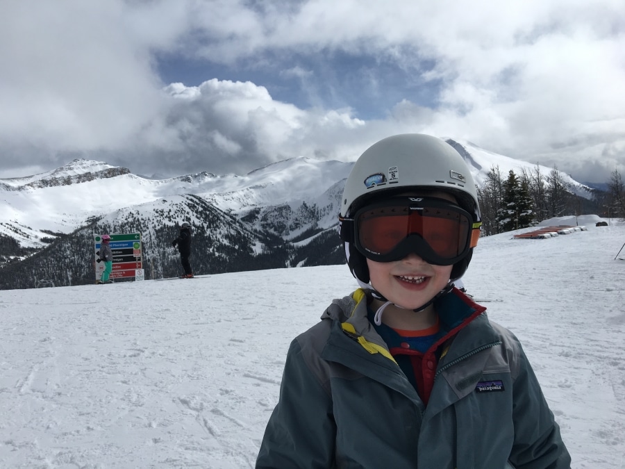 Happy kid on a family ski trip