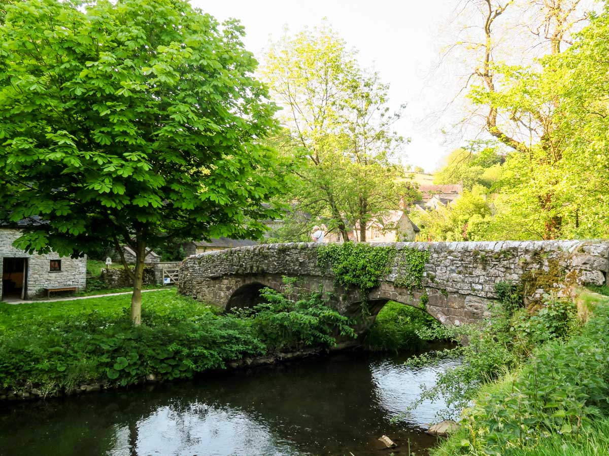 Viator's bridge and the village of Milldale from the Dovedale Circular Hike in Peak District, England