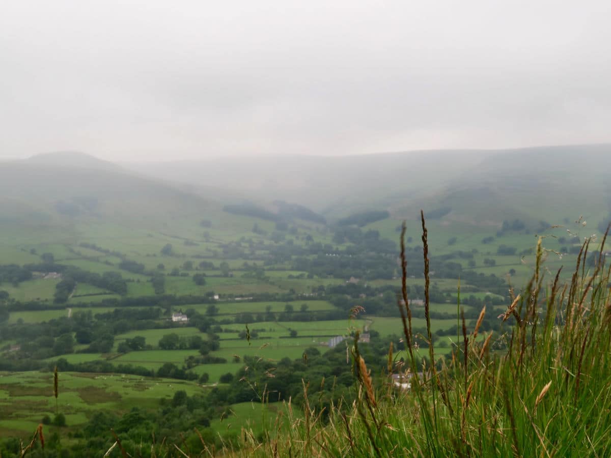 Edale hiding in the valley mist on the Great Ridge and Win Hill Hike in Peak District, England
