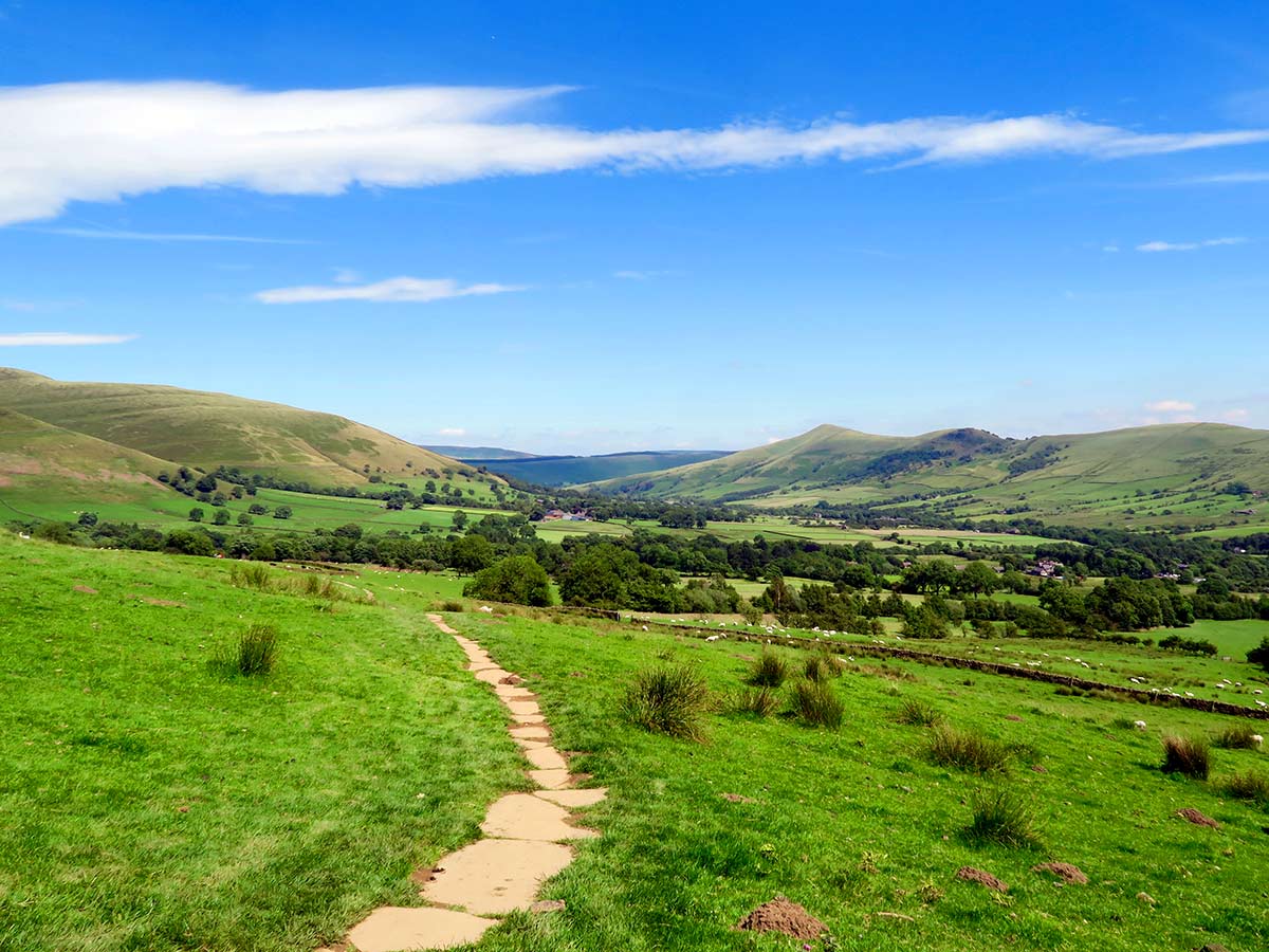 The Vale of Edale Hope Valley ridge in the background on the Kinder Scout Hike in Peak District, England