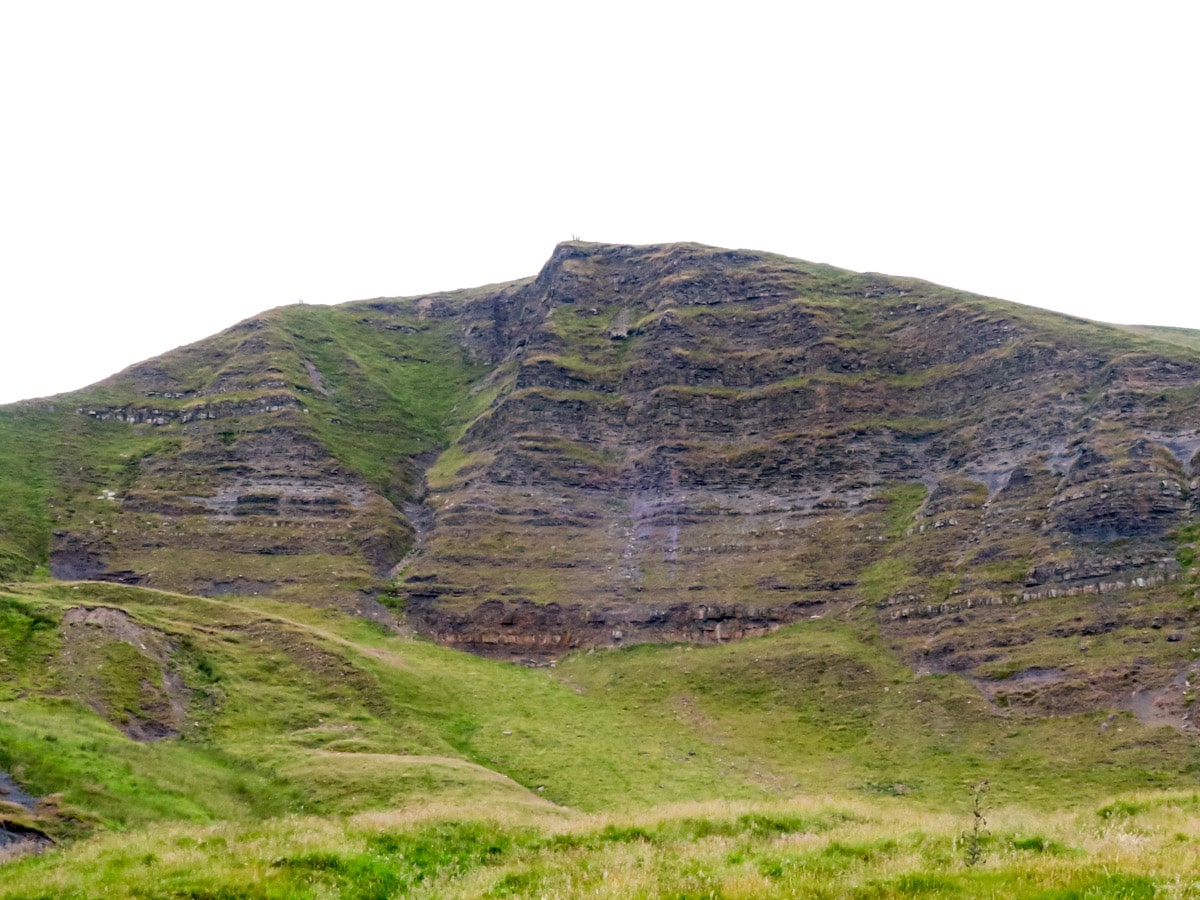 The steep cliff of south face of Mam Tor Peak on Mam Tor Circular Hike in Peak District, England