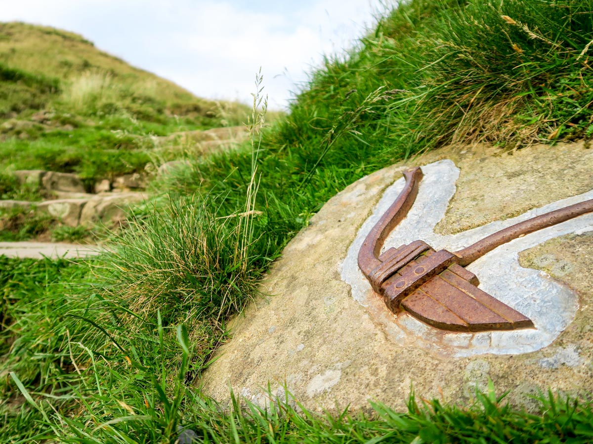 Stone symbol along Mam Tor Circular Hike in Peak District, England