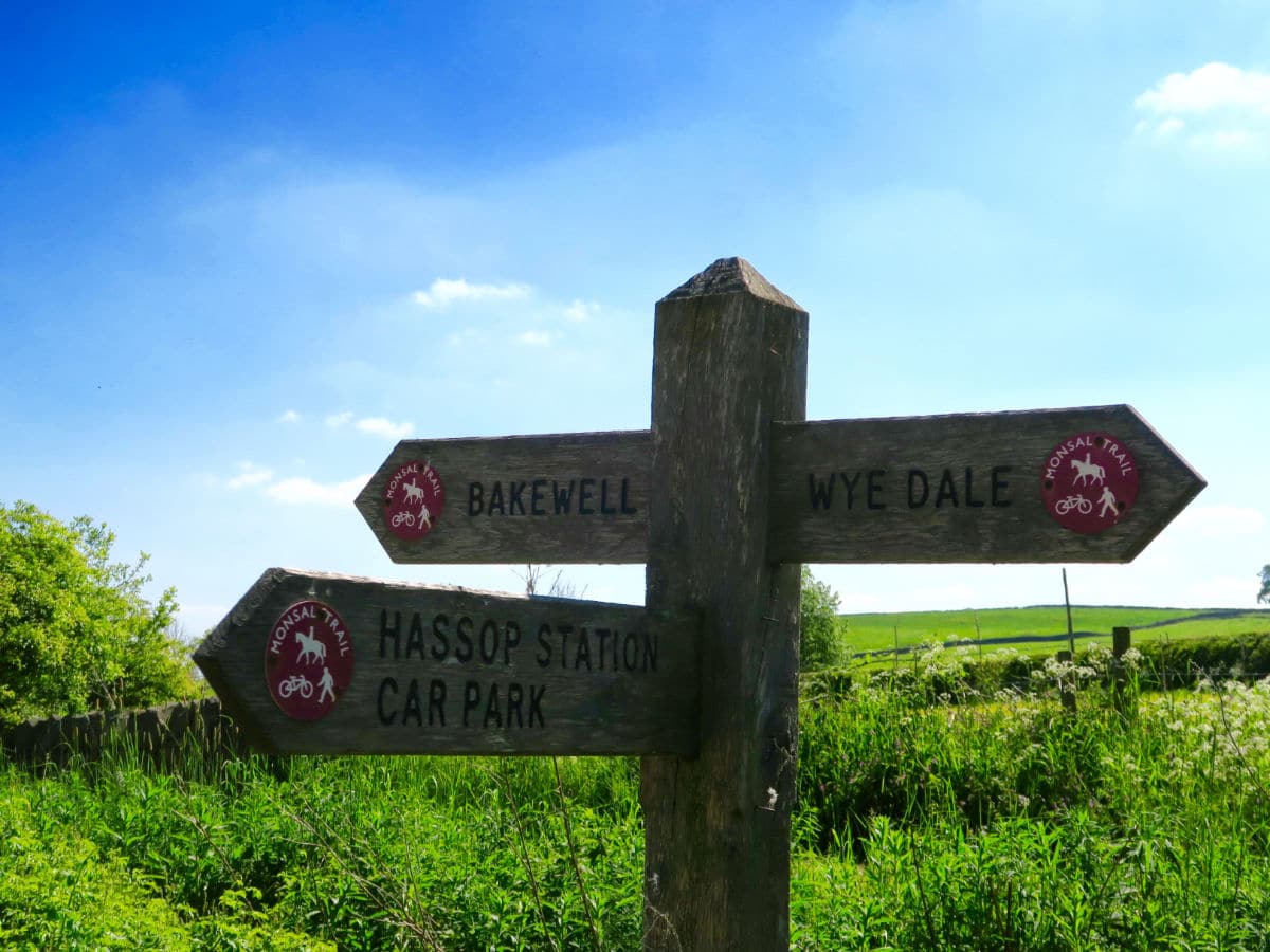 Trail signpost on the Monsal Trail Hike in Peak District, England