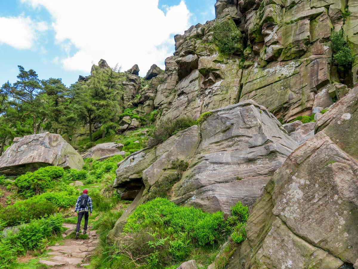 Beneath the crags on The Roaches and Lud's Church Hike in Peak District, England