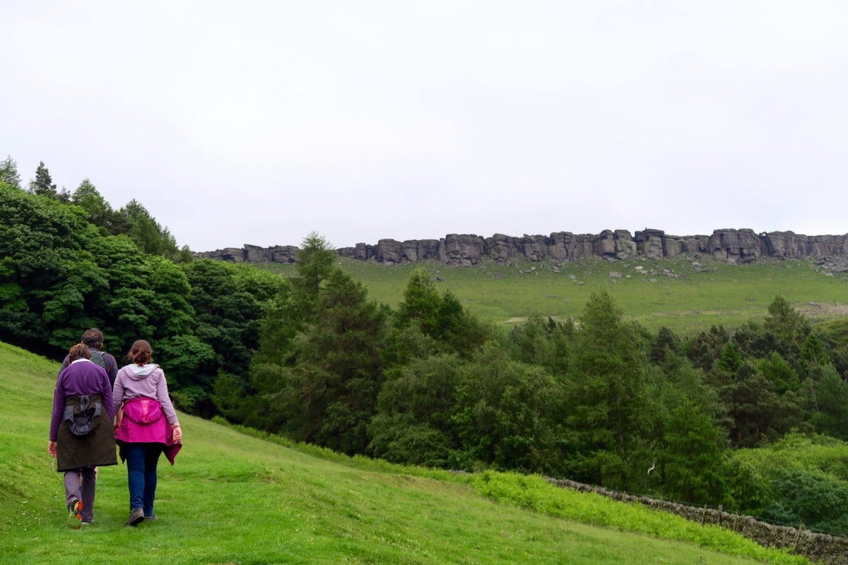 Walking towards Stanage Plantation on the Stanage Edge from Hathersage Hike in Peak District, England