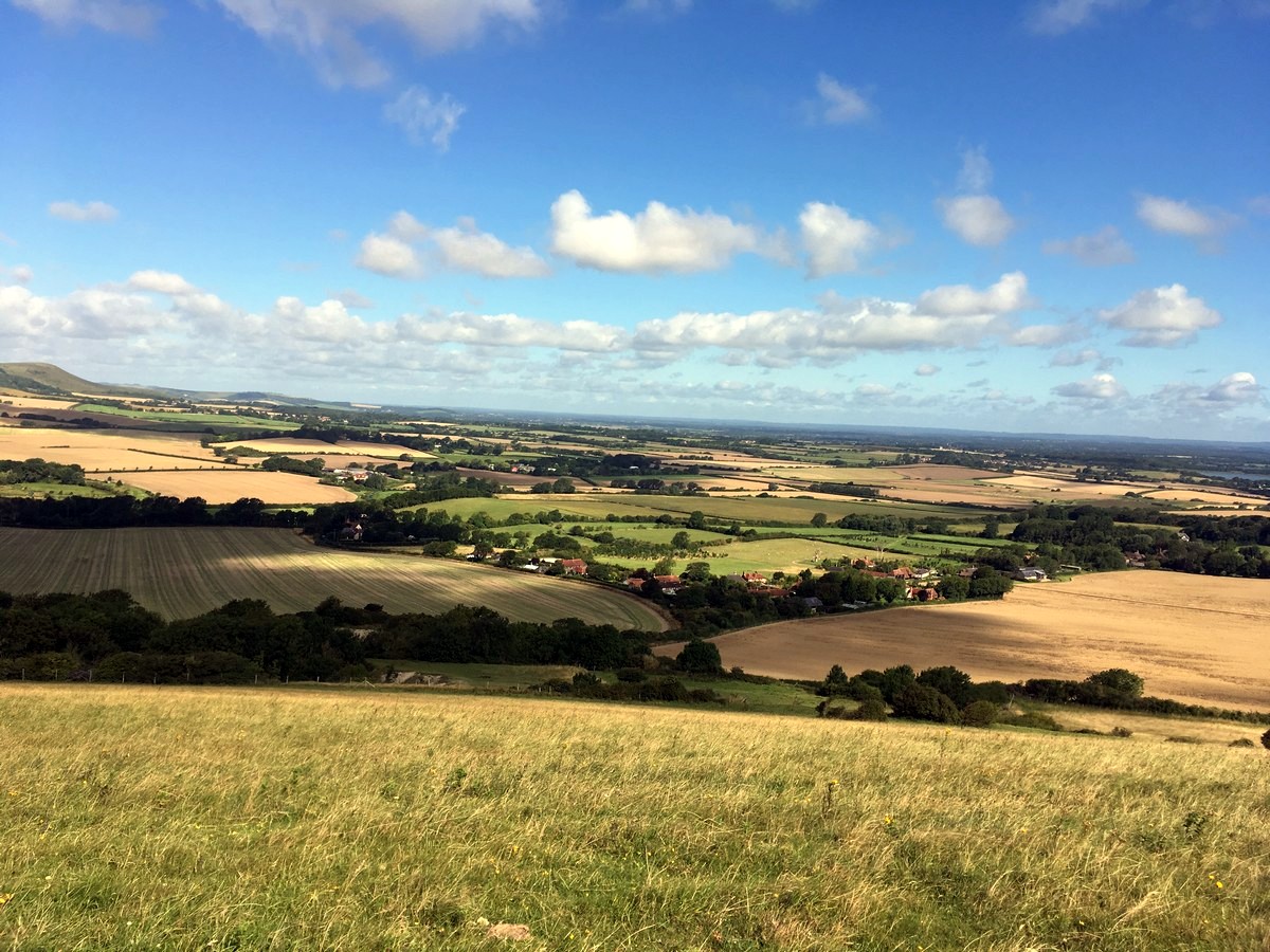View across Cuckmere valley from the Long Man of Wilmington to Alfriston Hike in South Downs, England