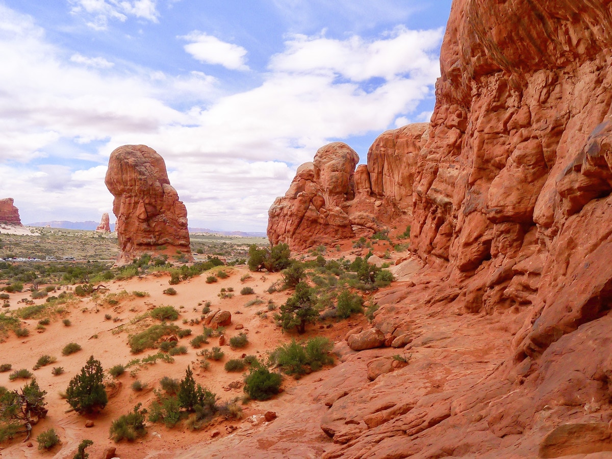 Delicate Arch hike in Arches National Park is surrounded by beautiful cliffs