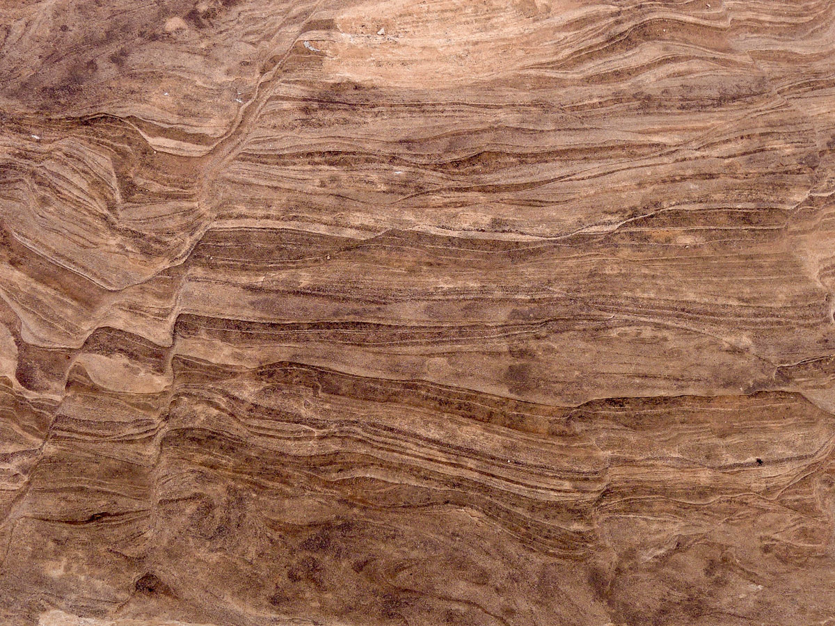 Rocks are covered by beautiful pattern on Park Avenue hike in Arches National Park, Utah