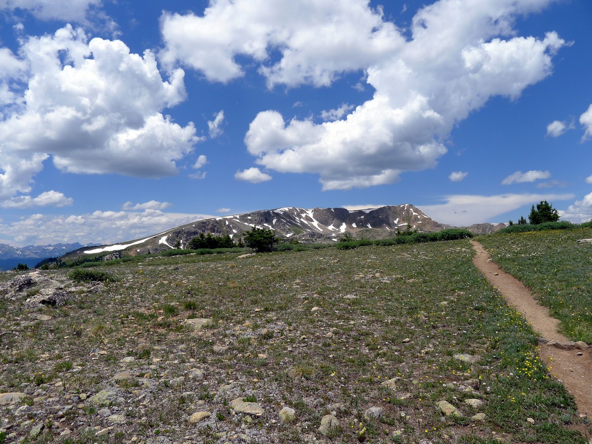 Cresting the highpoint on the Midway Pass Hike near Aspen, Colorado