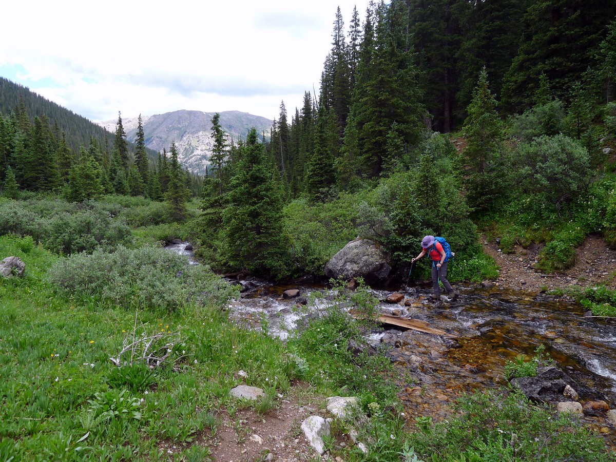 Crossing the creek on the New York Creek Trail Hike near Aspen, Colorado