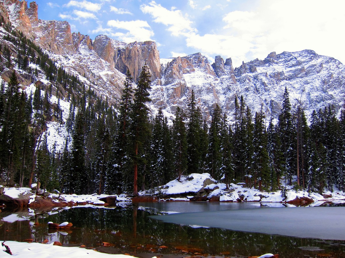 Mountain cirque reflecting in the lake on Lone Eagle Peak Hike in Indian Peaks, Colorado