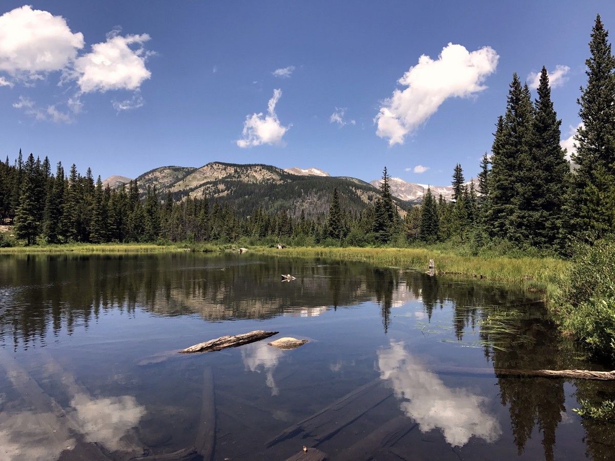 Clouds reflecting on the lake on Lost Lake Hike in Indian Peaks, Colorado
