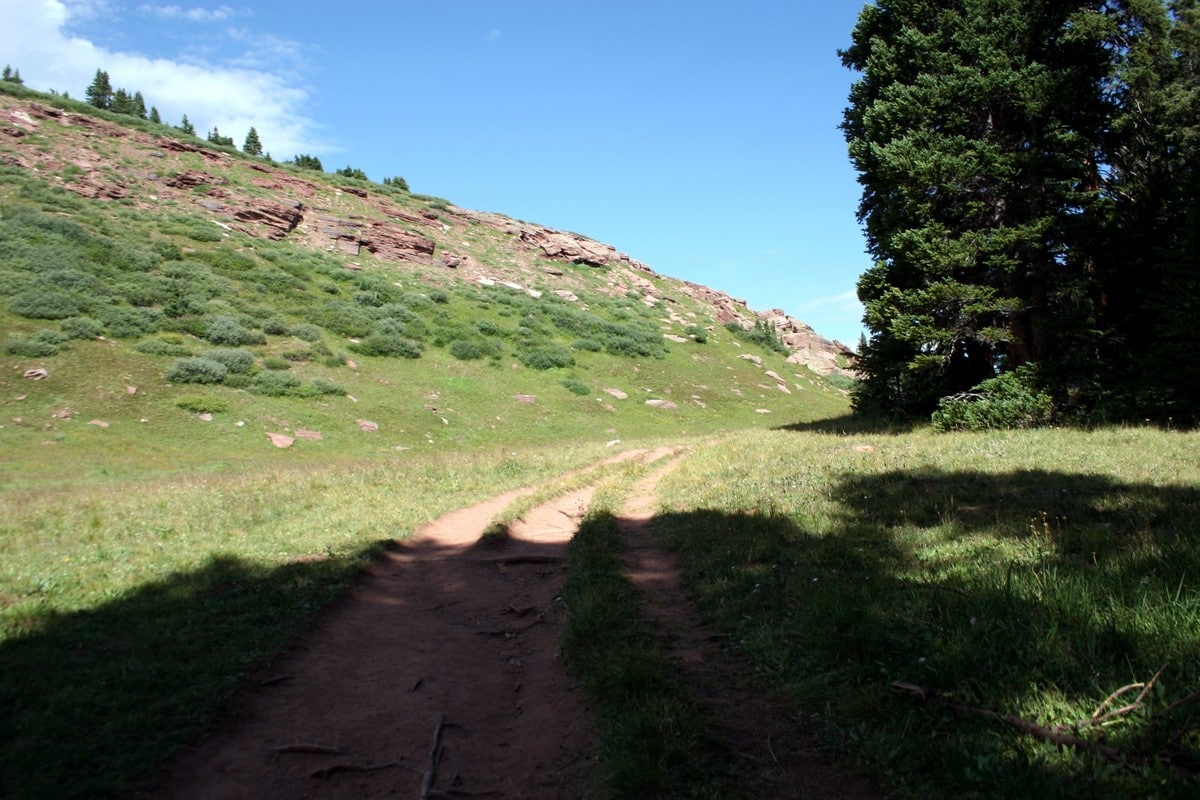 Hiking along the side of the ridge on the Shrine Ridge Trail Hike near Vail, Colorado