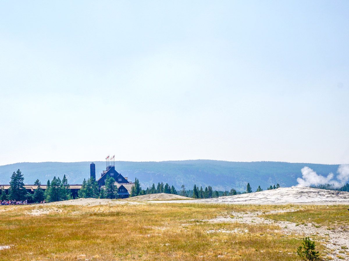 The Old Faithful and the Tourist Information Center on the Upper Geyser Basin trail in Yellowstone National Park, Wyoming