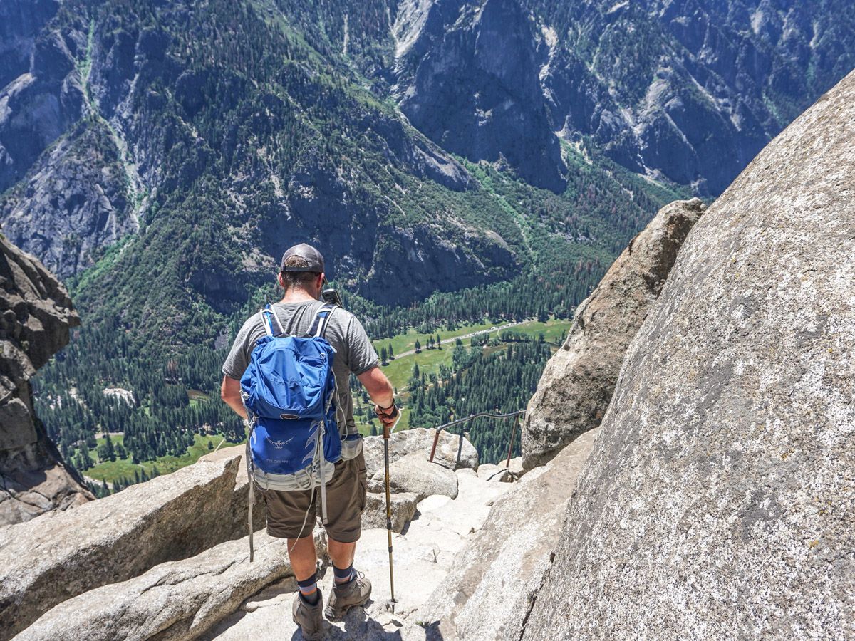 Man with hiking gear on the Yosemite Falls Hike in Yosemite National Park, California